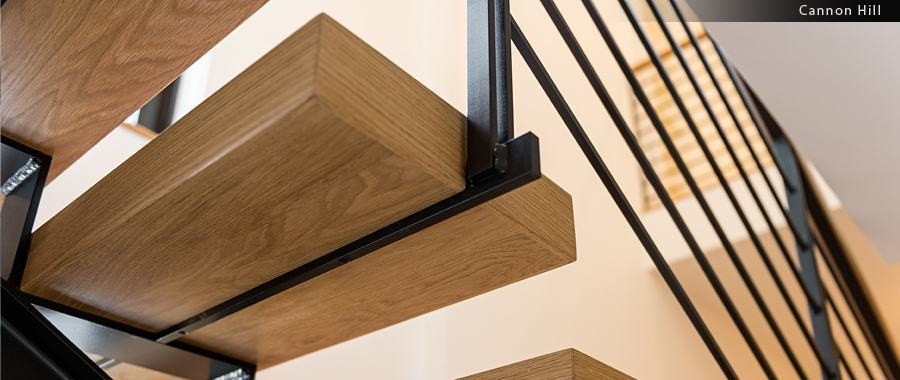 White oak and blackened-steel floating stair detail
