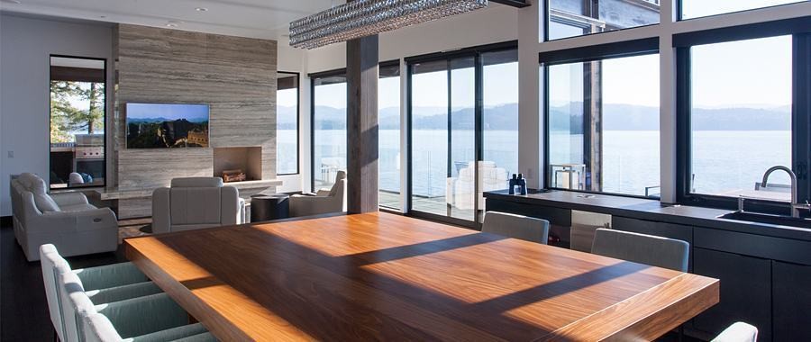 Cliff Residence dining room with book-matched walnut table and lake view