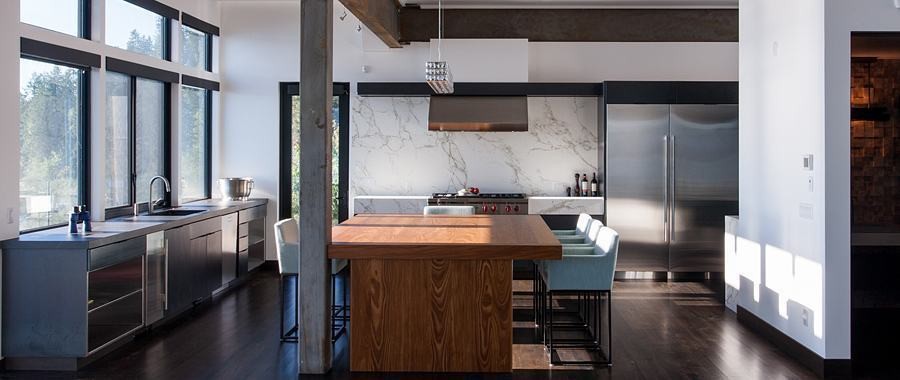 Cliff Residence modern kitchen with marble backsplash and walnut island
