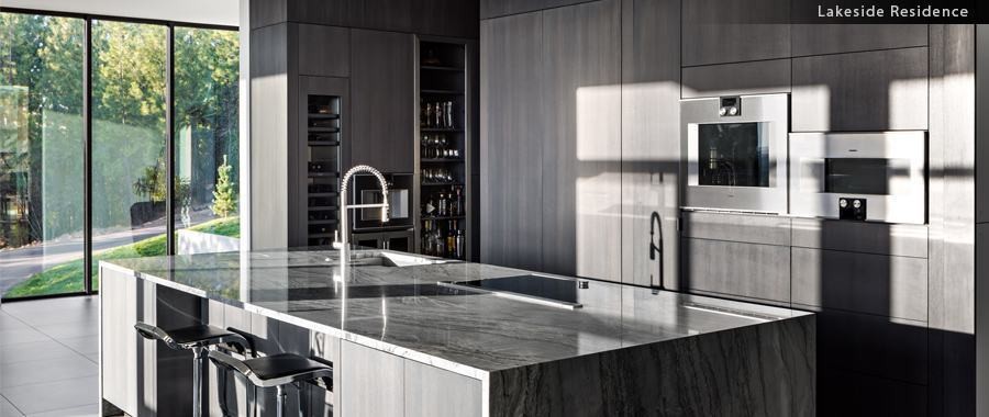 Lakeside Residence — modern kitchen with marble waterfall island