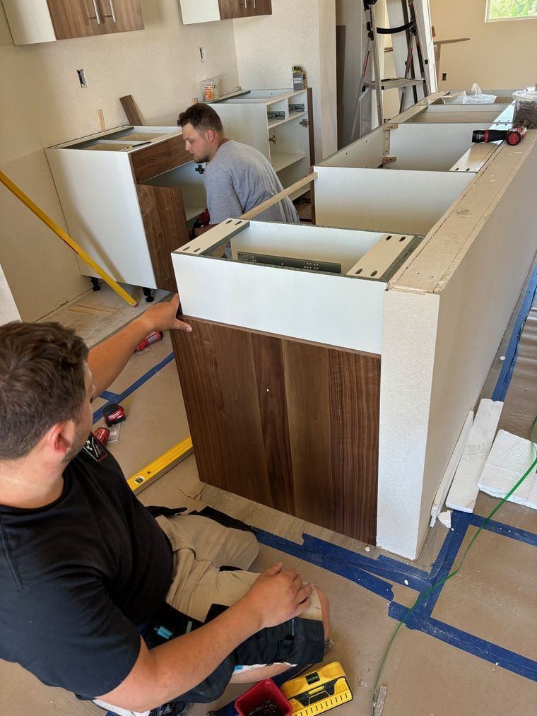 Ashworth crew installing custom casework on site
