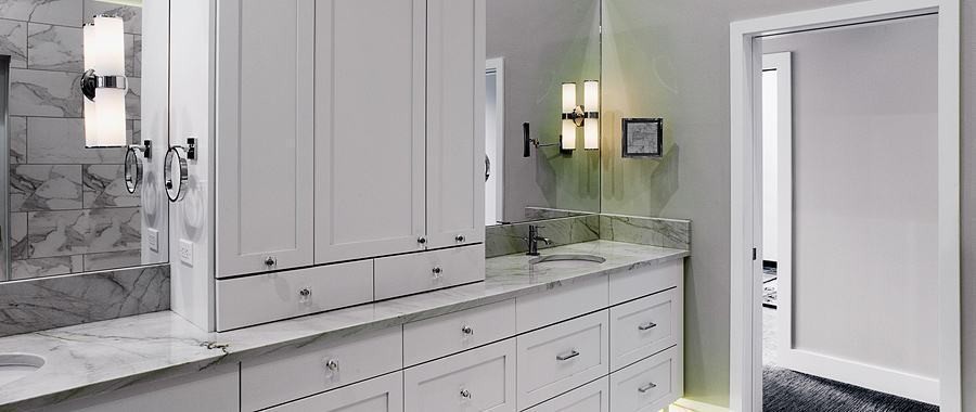 Southfork Remodel — marble vanity with tall linen cabinet