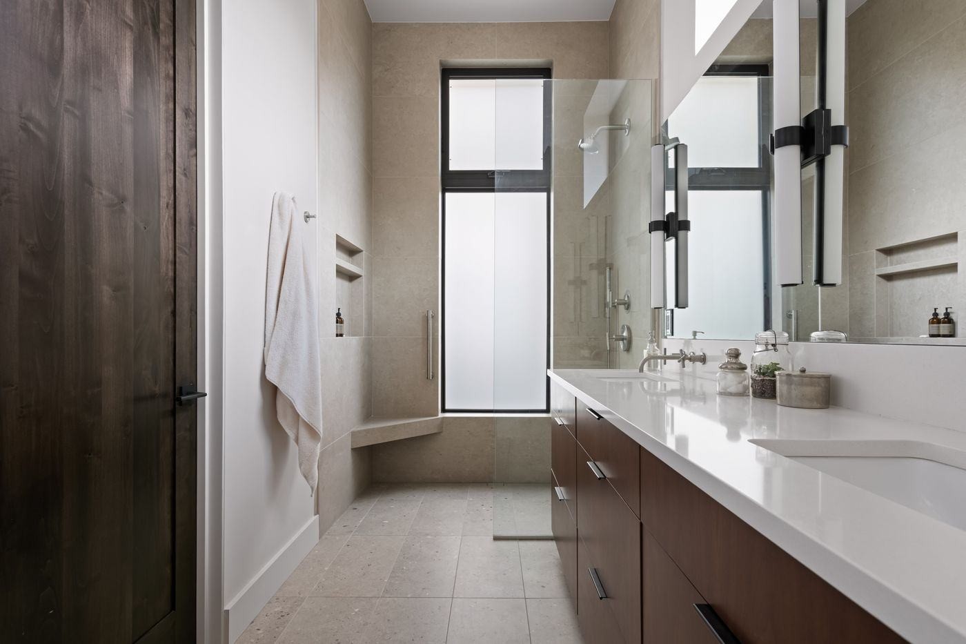 VanderWilde Residence bath with walnut vanity, quartz counters, and walk-in shower