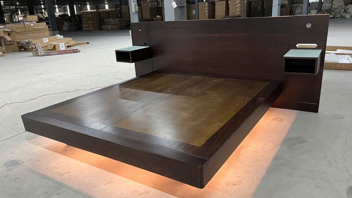 Custom walnut platform bed with floating nightstands and cove lighting