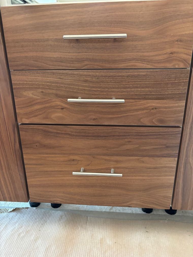 Finished walnut casework with satin bar pulls